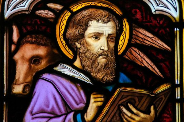 MECHELEN, BELGIUM - NOVEMBER 4, 2016: Stained Glass window depicting Saint Luke the Evangelist, in the Cathedral of Saint Rumbold in Mechelen, Belgium.