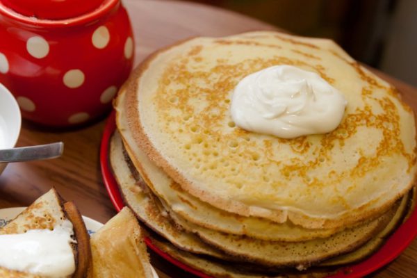delicious breakfast of pancakes with sour cream
