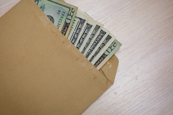 hundred dollars out of one hundred dollar bills in an envelope