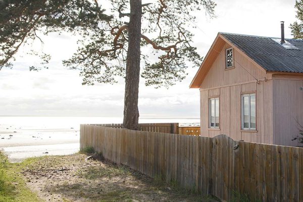 Cozy country house for holiday on the seaside in a pine forest. Realty concept.
