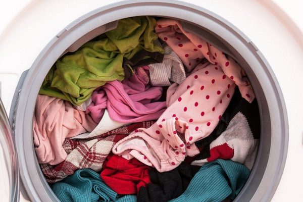 16756035 - washing machine full of dirty clothes, closeup