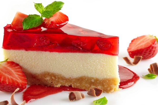 cheesecake with fresh berries and sweet strawberry sauce