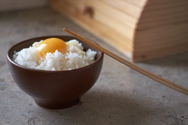 Tamago kake gohan with raw egg in bowl
