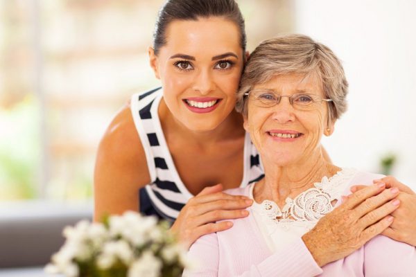pretty woman and senior mother at home