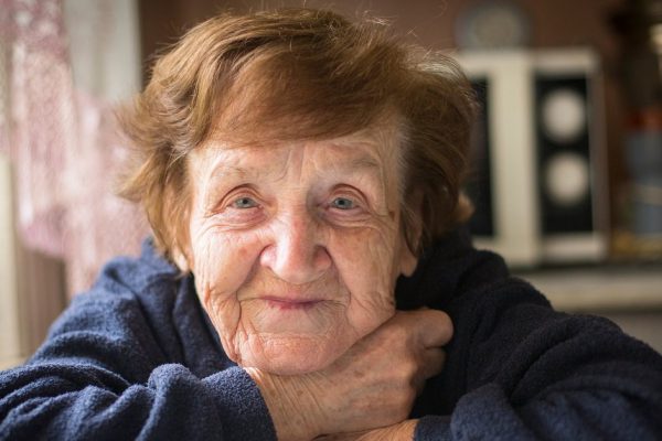 Close-up portrait of an happy old woman