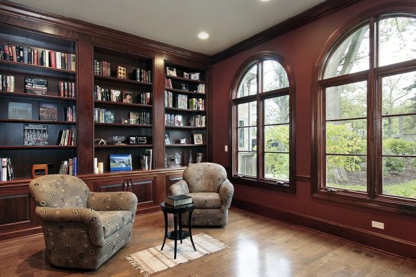 Library with curved windows in luxury home