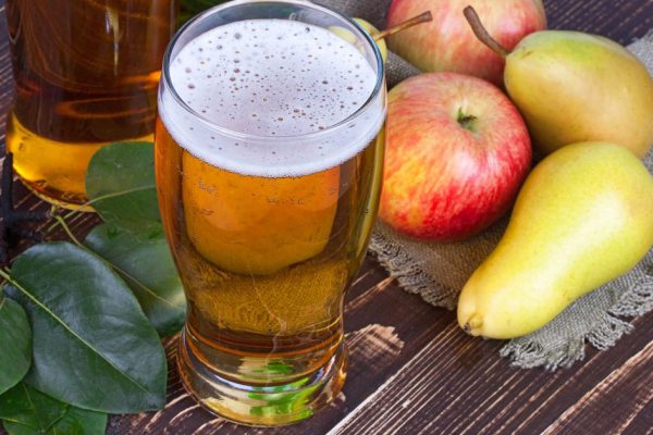 Glass and bottles of cider