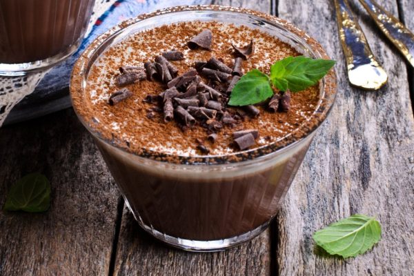 Chocolate jelly in a glass dish on a wooden surface