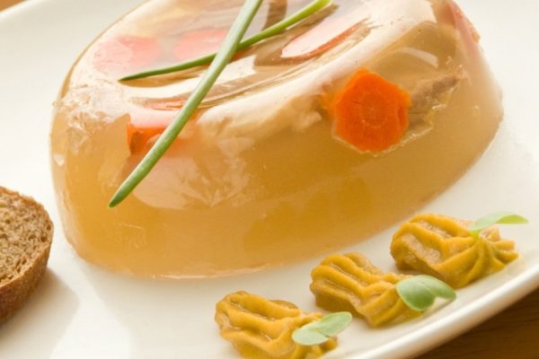 Plate with ukrainian traditional meat aspic. Shallow dof.