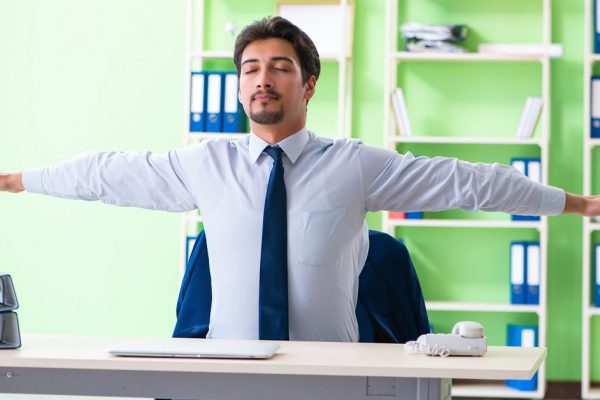 Employee doing exercises during break at work