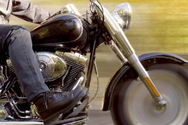 Detail of man on a motorcycle