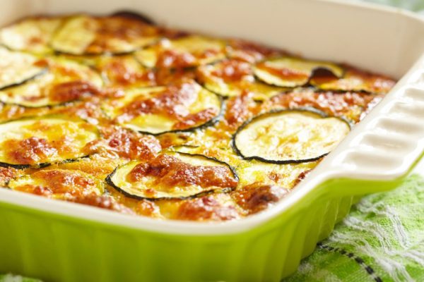 casserole with cheese and zucchini in baking dish