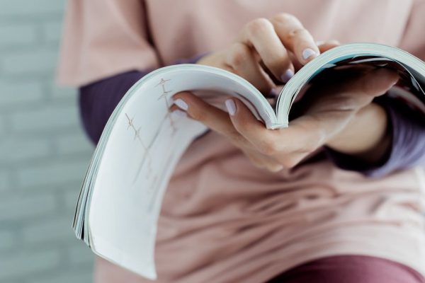 woman reading a magazine