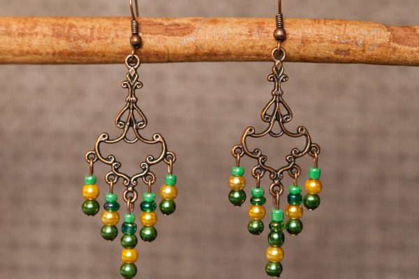 coloured earrings on brown background