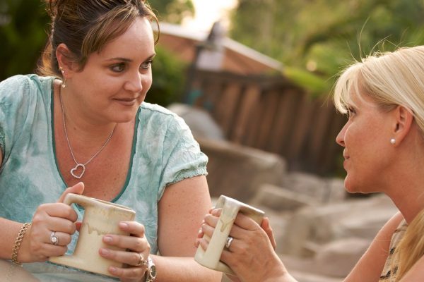 Two Girlfriends Enjoy A Casual Conversation