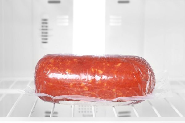 Tasty sausage in refrigerator