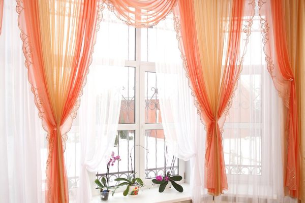 the windows decorated with curtains with a machine embroidery, double 12