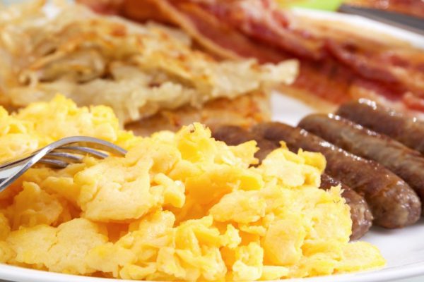 Stock image of hearty breakfast, focus on foreground.