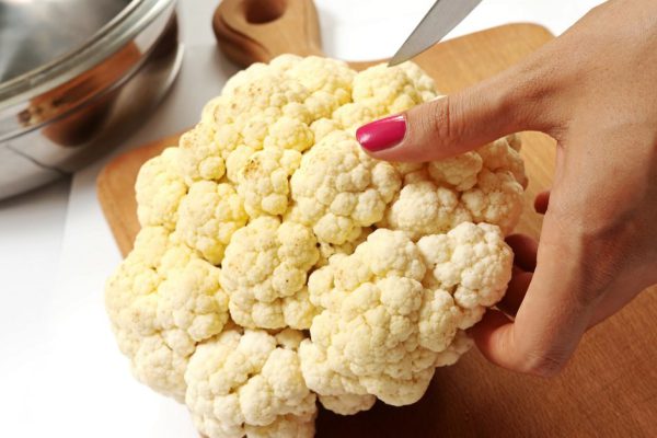 female chopping food ingredients