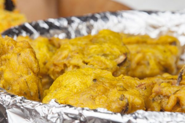 Vegetables fried rolls in batter also called Mshat Zahra. Large bowl covered with foil