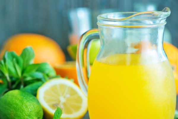 fresh juice in glass dishware and on a table