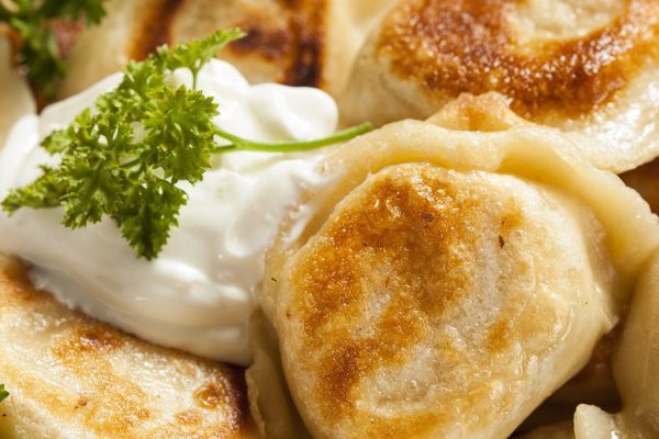 Homemade Polish Pierogis with Sour Cream and Parsley