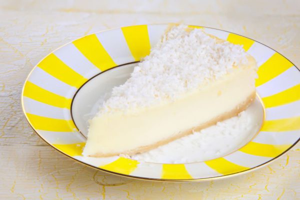 delicious cheesecake with coconut on a plate