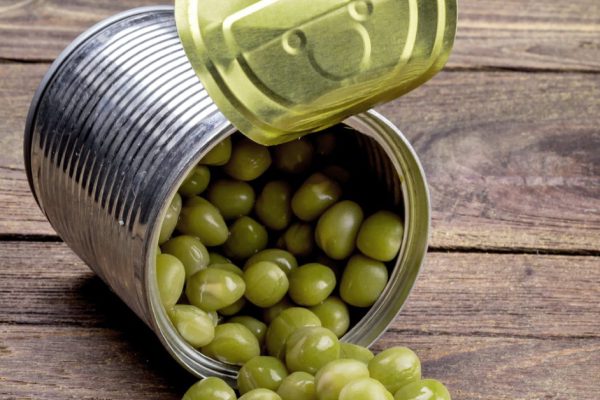 Canned Peas on vintage wooden background
