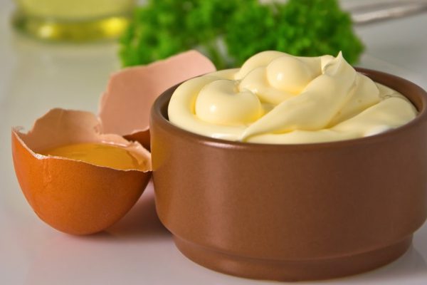 mayonnaise and its ingredients on the table