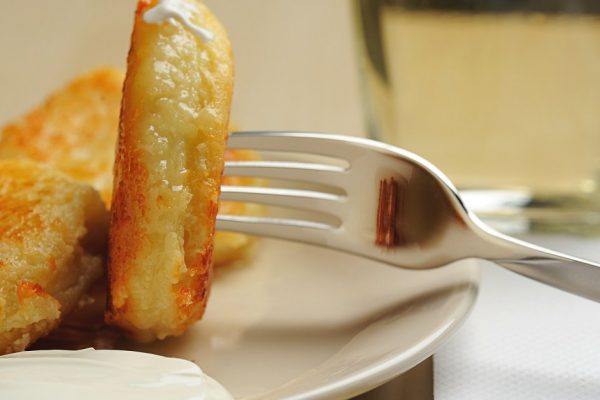close up of cheese cottage on fork and with juice