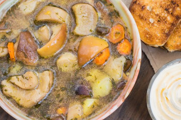 Mushroom soup with cream. Wooden background. Top view. Close-up