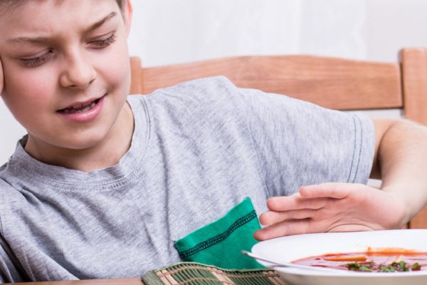 Young child does not like his mother's soup