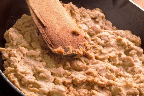 close up of a pan of refried beans
