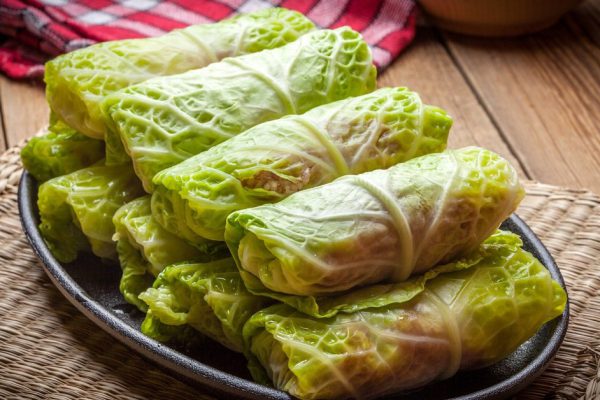 Cabbage rolls stuffed with meat and grits prepared for cooking.