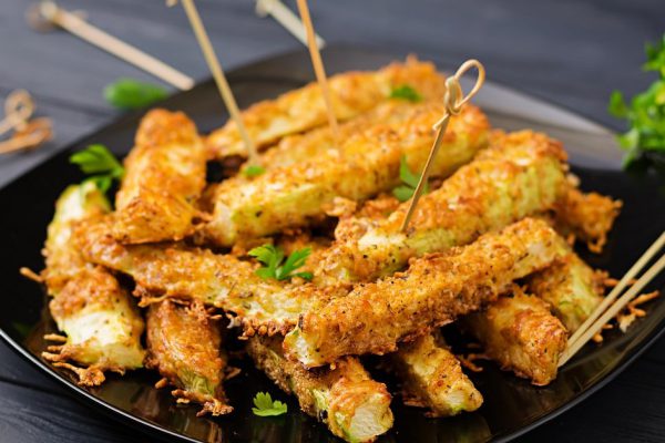 Zucchini slices baked under cheese breading