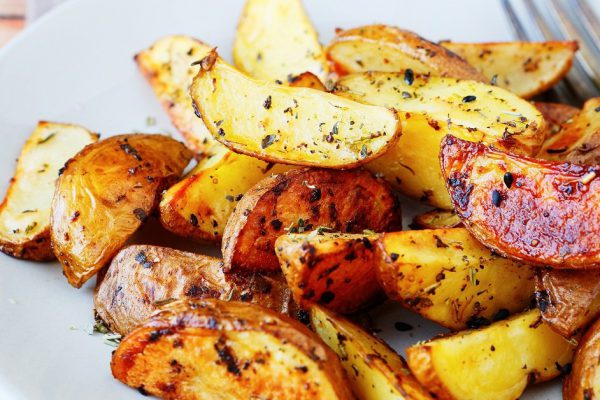 potato wedges with the peel in spices, food closeup