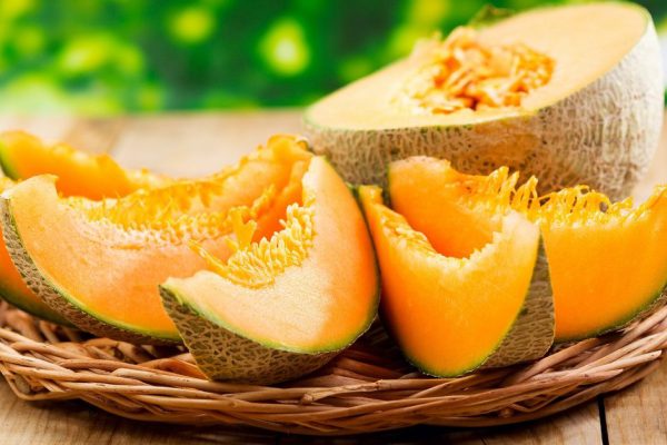 fresh melon on wooden table