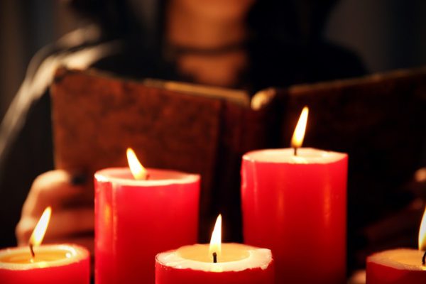 Witch - fortune teller with candles close up