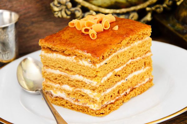 Delicious Honey Cake Decorated with Chocolate. Studio Photo