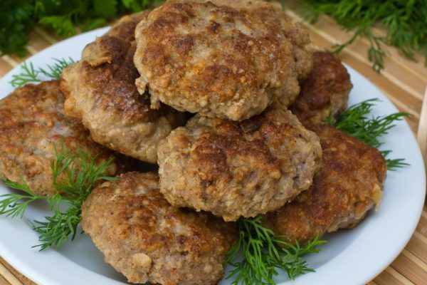 Fried cutlet with dill on a plate
