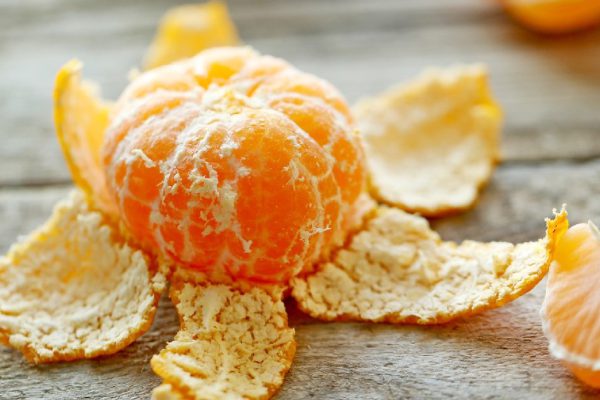 Tangerines on old wooden table, close up