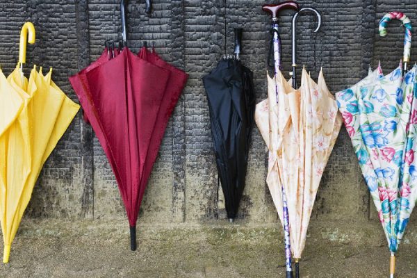 Colorful Umbrellas Leaning Against a Wall