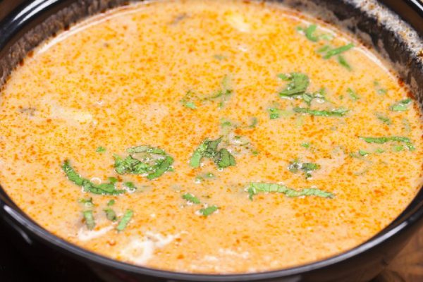 Tom Yam Kung, thai food on a wooden tray