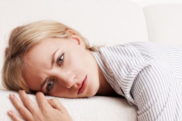 Sad young woman at home. Female grief