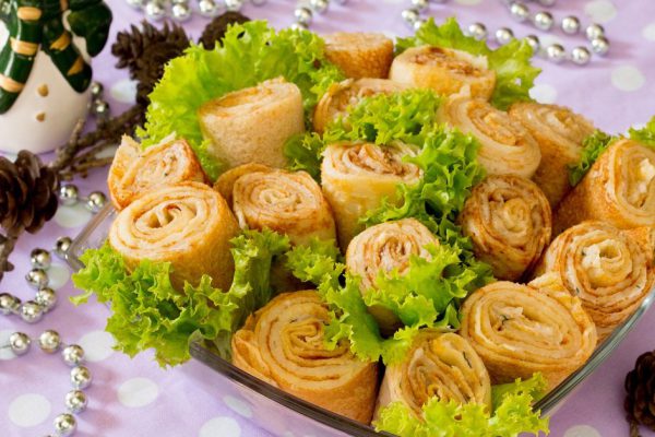 Herring pancake rolls with salad of fresh leaves