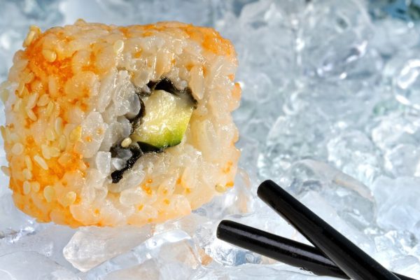 sushi with black chopstick