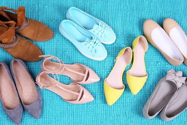 Female fashion shoes on blue carpet