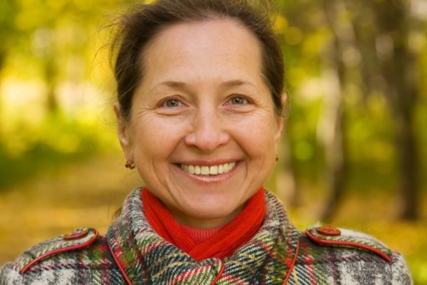 Portrait of elderly woman  in autumn park