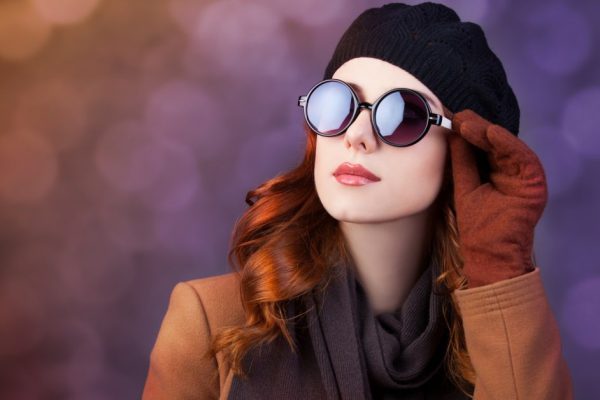 Style redhead women in sunglasses.