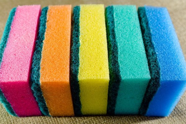 Multi-colored sponges in a row. Microfiber material. Dish washing.